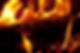 Hot coals and flames emitting from a hot burning fire