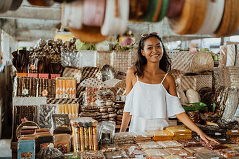 A woman standing at a souvenir store