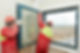 Professionals installing a new double-glazed window