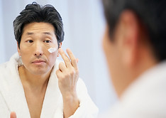 Man Applying Skincare