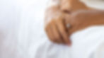 Close-up of two hands gently clasped, symbolizing support and connection in a relationship.