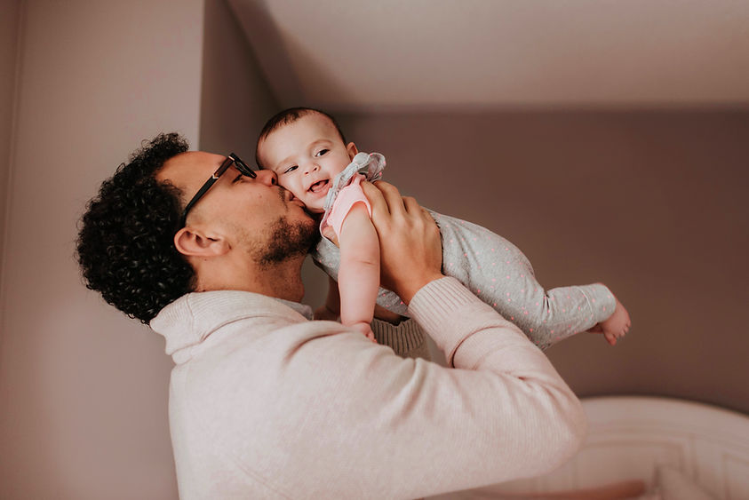 Father Kissing Baby