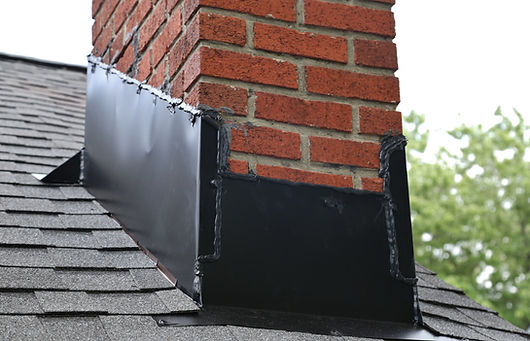 Black lead flashing valley piece fitted securely between roof tiles