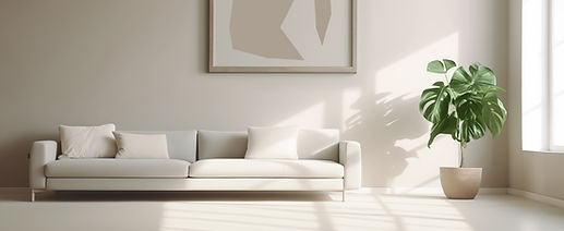 Minimal Interior Design with a white couch and a plant beside it