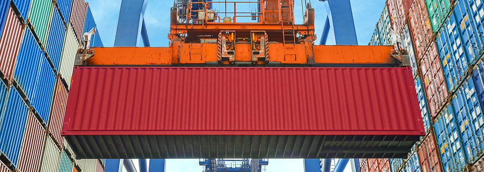 A Crane Lifting a Container
