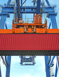 A Crane Lifting a Container