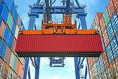 A Crane Lifting a Container