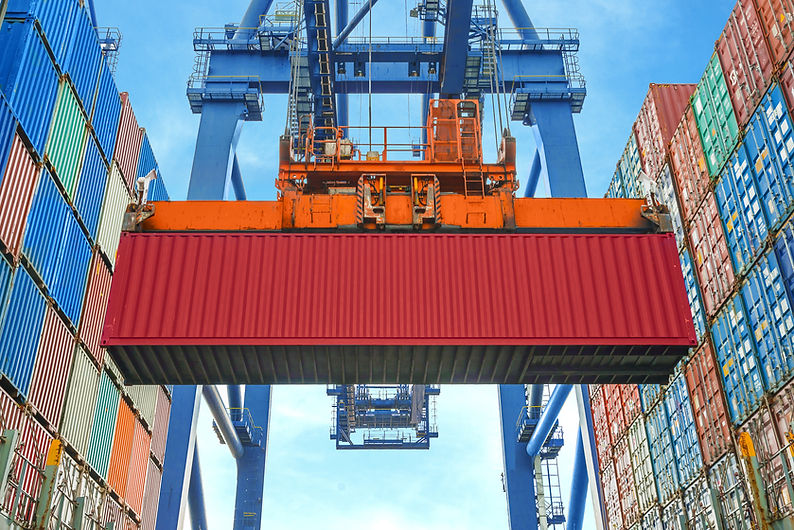 A Crane Lifting a Container