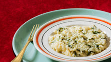 Creamy mushroom and sundried tomato risotto in a bowl with parmesan