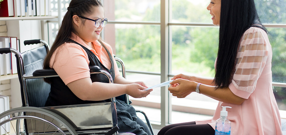A woman and another woman on a wheelchair