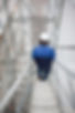 Construction worker walking down a scaffold system