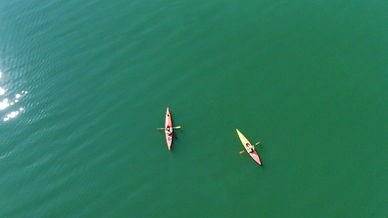Kayakers on green water