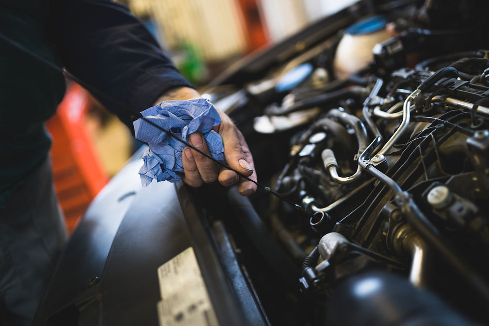 Close-up view of mechanic’s hand doing car service and maintenance
