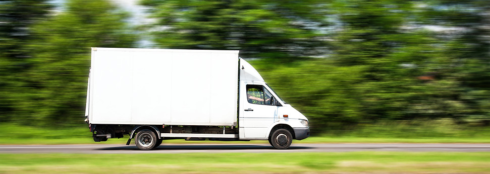 Delivery van on highway, motion blur