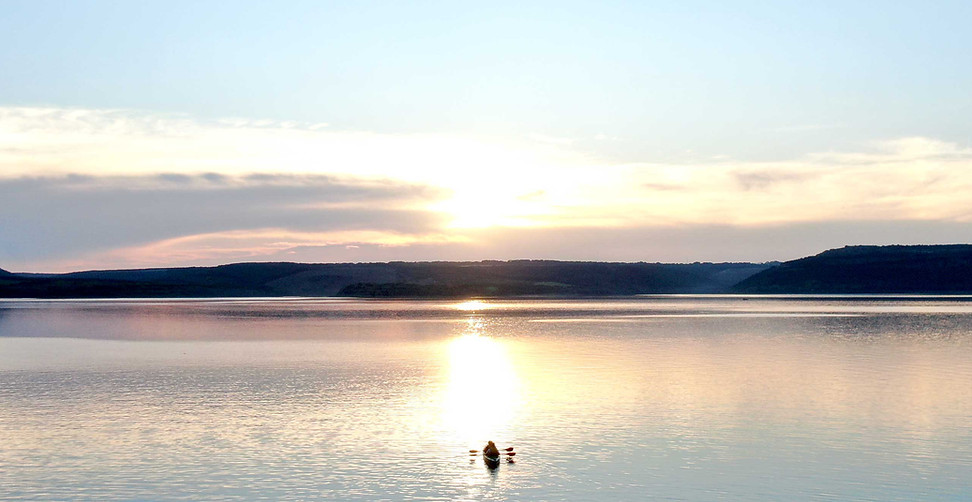 Kayakers on calm lake