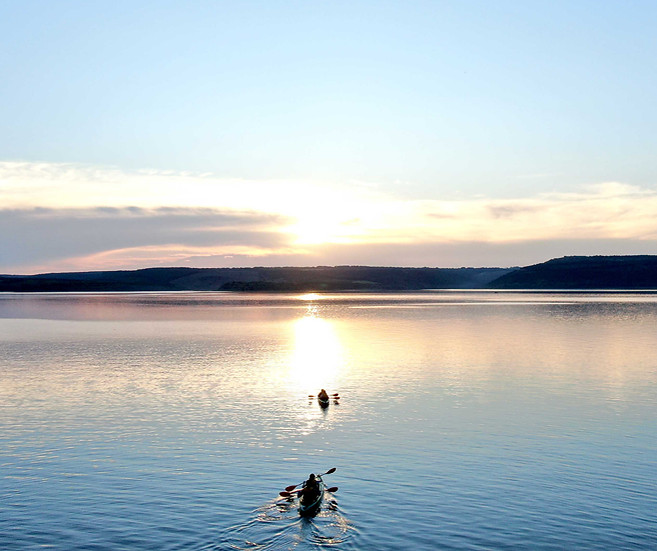 Kayakers on calm lake