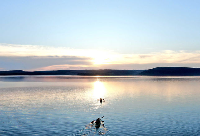 Kayakers on calm lake