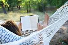 Relaxing, reading on a hammock
