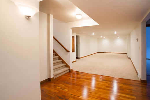 A close up shot showcasing the detailed grain patterns and natural textures of premium wood flooring planks inside a bright room