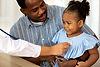 Doctor examining child