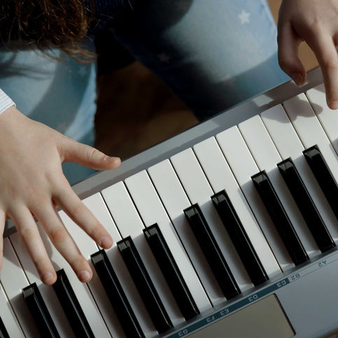 A girl Playing Pinao