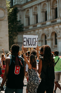 Protest with 'Enough' Sign