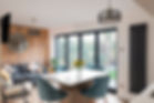Home interior with open plan kitchen, lounge and dining area