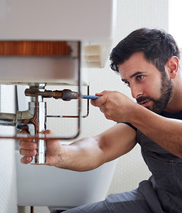 Plumber Fixing Pipe