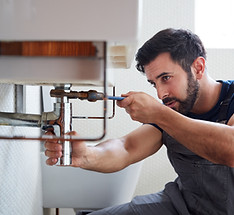 Plumber Fixing Pipe