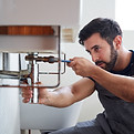 Plumber Fixing Pipe