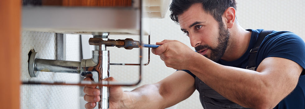plumber working in a topsham kitchen