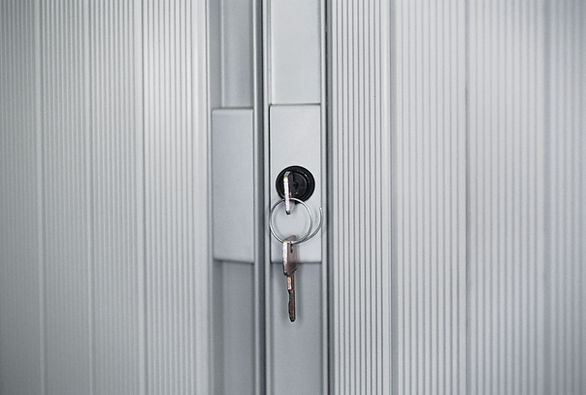 Close-up of modern patio door lock with inserted key