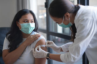 Nurse puts plaster on patient