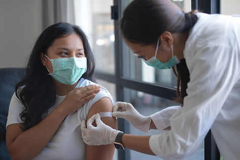 Nurse puts plaster on patient