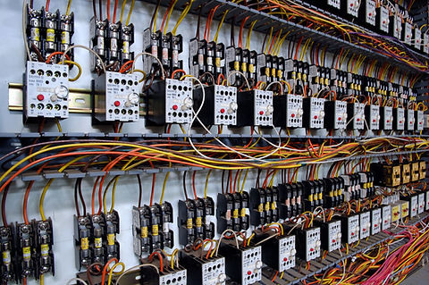 Electrical wiring panel at a assembly line factory. Controls and switches
