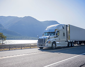 Truck Driving by Lake