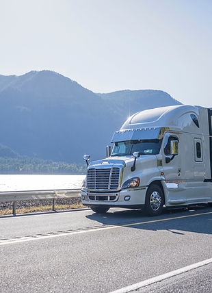 Truck Driving by Lake