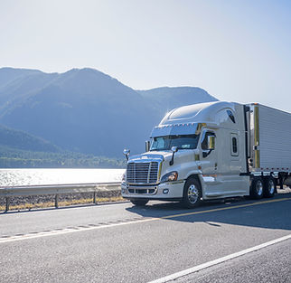 Truck Driving by Lake