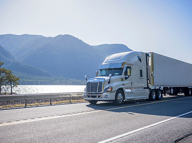 Truck Driving by Lake