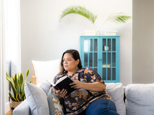 Woman thinking about her book.