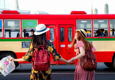 Two female tourists about got get on a bus