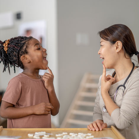 Teacher and student practicing speech.