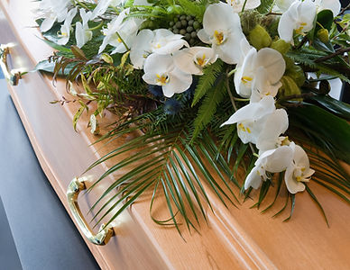 A coffin with a flower arrangement