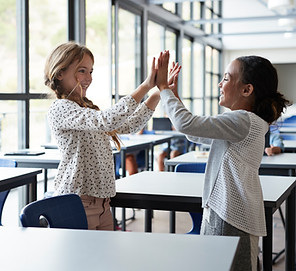 Students High-Fiving