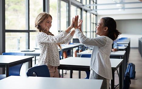 Students High-Fiving
