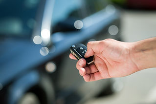 Car key held by hand
