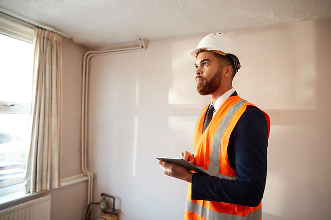 A professional is inspecting the interior of a building