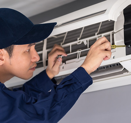 Technician Repairing Air Conditioner