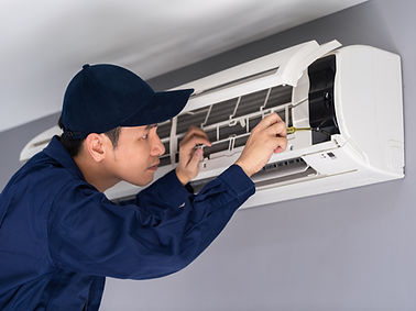 Technician Repairing Air Conditioner