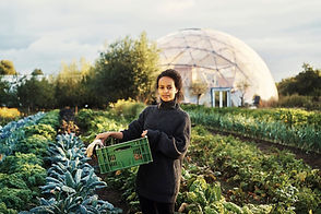 Woman In Greenhouse